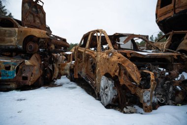 Stacked a bunch of crashed cars after fire and missiles attacks in city