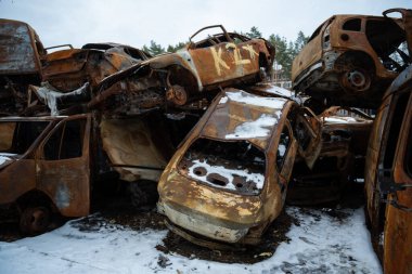 03.02.2023 Irpin, Ukraine: Stacked a bunch of crashed cars after fire and missiles attacks in city