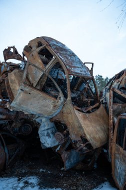 03.02.2023 Irpin, Ukraine: Stacked a bunch of crashed cars after fire and missiles attacks in city