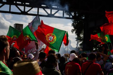 Hamburg, Germany - July 5, 2024: Portuguese fans celebrating Euro 2024 in the streets of the city clipart