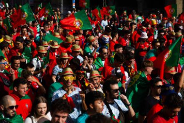 Hamburg, Germany - July 5, 2024: Portuguese fans celebrating Euro 2024 in the streets of the city clipart