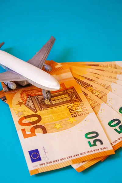 Concept Preparation for travel, money, passport, plane close-upselective focusholidays