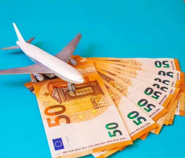 Concept Preparation for travel, money, passport, plane close-upselective focusholidays
