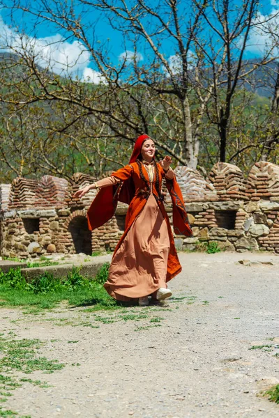 Georgian girl in national costume dances Georgian national dances. selective focus.people