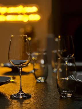 Elegant table set up for dining room, dim light.