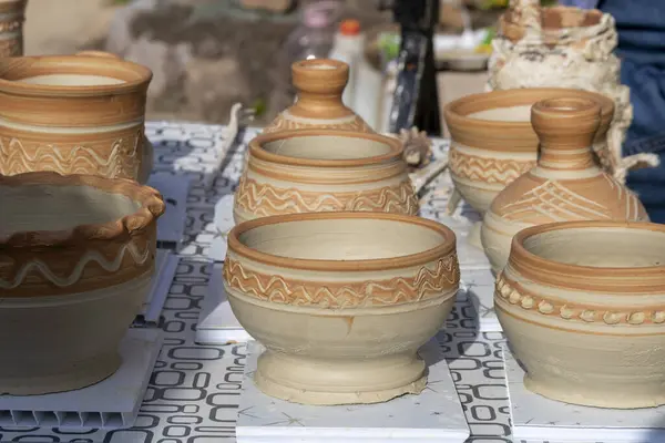 Pots in the shop. Ceramics. Cultural traditions. Self made. Craft