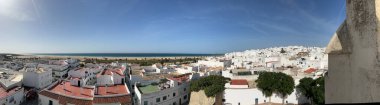 Panoramic view over the city and beach in Conil de la Frontera from Torre de Guzman in Spain clipart