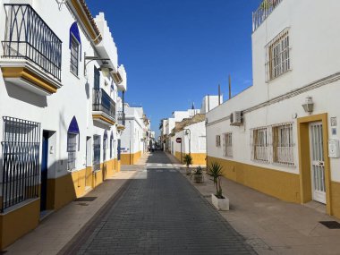 Street in the old town of Chipiona in Andalusia, Spain clipart