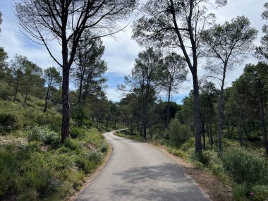 Road through nature reserve around L Escala in Catalonia, Spain clipart