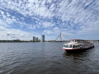 Boat at the Daugava river in Riga, Latvia clipart