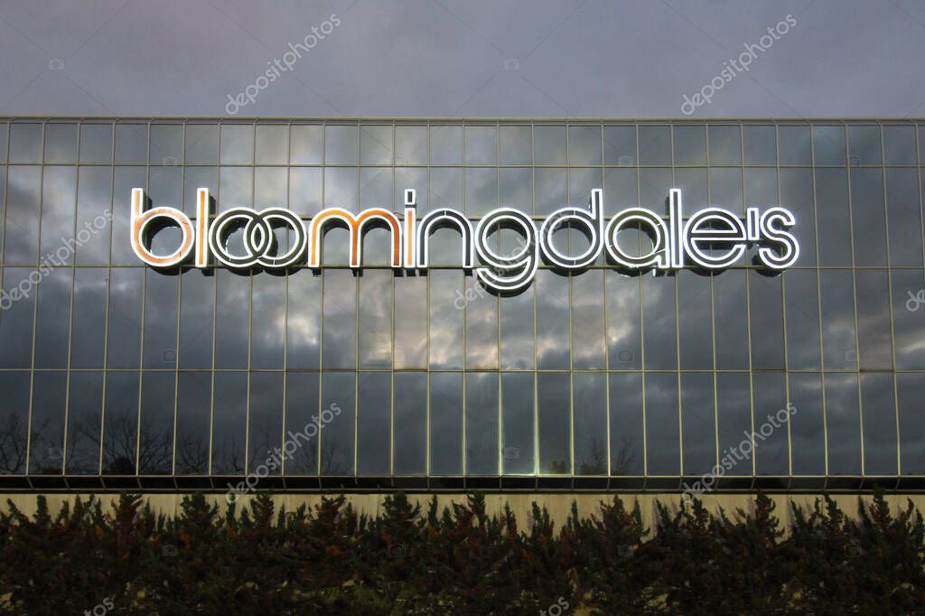 White Plains, NY - November 6, 2022 : Illuminated front sign and windows at Bloomingdale's department store in New York