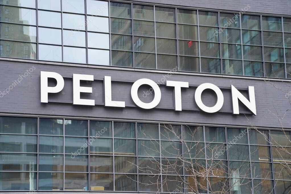 New York, NY - March 31, 2023: Close up of exercise equipment manufacturer  and online subscription classes Peloton sign on Midtown Manhattan building.