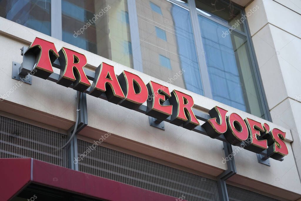 Washington, DC - April 4, 2023 : Close-up of red exterior Trader Joe's supermarket sign.