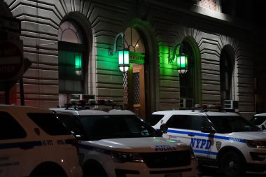 Bronx, NY - April 23, 2023 : Night view of front door entrance to the New York City Police Department's 45th precinct on Barkley Avenue, 10465 clipart