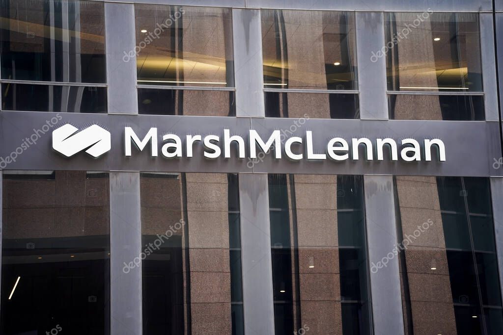 New York, NY - April 26, 2023 : Insurance company and financial brokerage firm Marsh McLennan sign with name and corporate logo on Midtown Manhattan office building