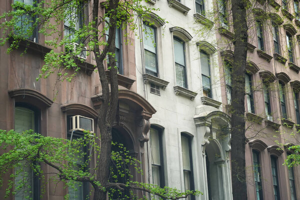Row of brownstone townhouses in wealthy Manhattan, New York City neighborhood