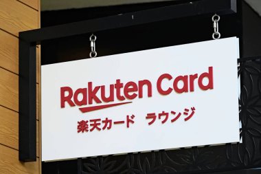 Honolulu, HI - December 8, 2023 : Rakuten Card customer service office and shop sign. Rakuten lounge is written in Japanese, Waikiki International Marketplace.  