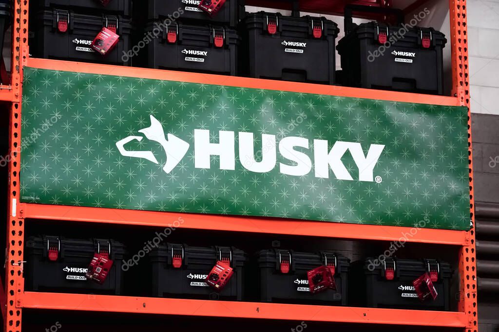 Honolulu, HI - January 12, 2024: Home Depot in house brand Husky tools logo banner advertisement an tool storage bins