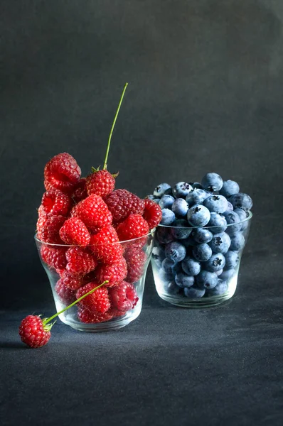 Fresh Raspberries Blueberries Glasses Black Grunge Background View Daylight Selective — Stock Photo, Image