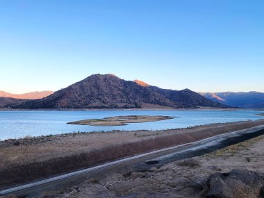 a mountain lake desert sunset aqueduct reservoir water environmental conservation