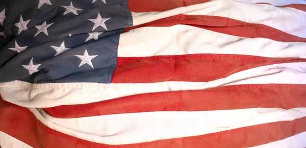 a wrinkled old vintage American flag holiday backdrop America pride event background