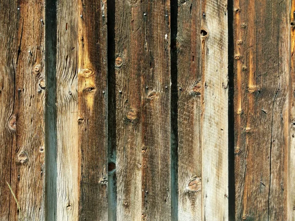a wooden weathered old garden yard fence backyard wood boards barrier
