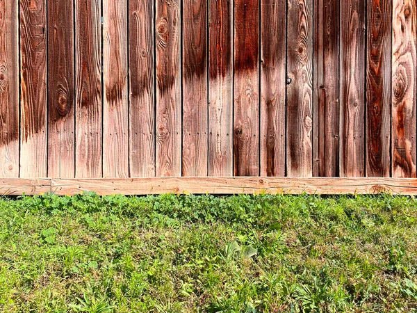a wooden garden fence sprinkler water landscaping lawn backyard wood fencing watering spray damage