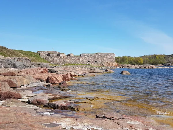 Rocky sea shore and part of an old fortification in Suomenlinna, Helsinki
