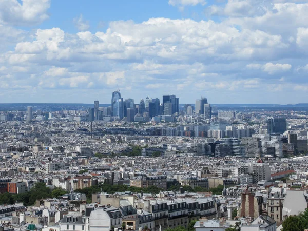 Paris rooftops with La Defense skyscrapers on the background