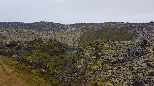 Lava field and a small lagoon in Iceland
