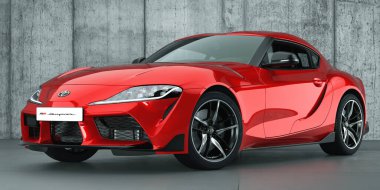 Sportif Toyota Supra beton bir stüdyonun arka planına karşı.