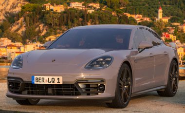 Porsche Panamera Turbo E-Hybrid standing in the parking lot. clipart