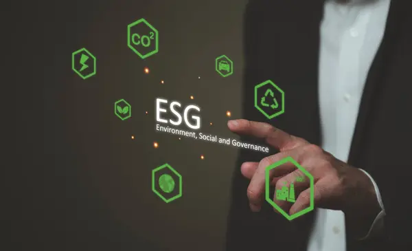 stock image Entrepreneur hand point at ESG digital screen dashboard while control and reduce carbon emission for global friendly business. Business with environment concern, carbon credit and zero emission.