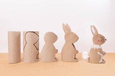 A Easter bunny made of recycled paper tube, DIY, tutorial, craft for kids clipart