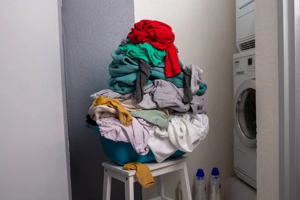 big heap of dirty laundry, colorful clothes