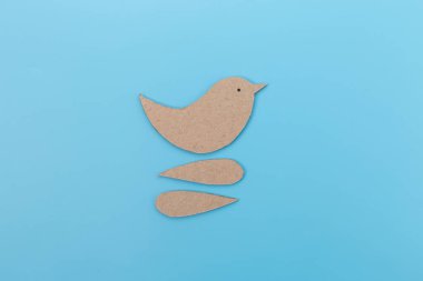 The main body of the bird is in brown cardboard color. process of making craft. DIY clipart