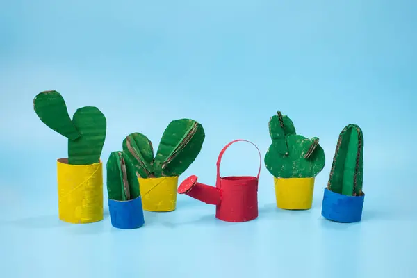 stock image Vibrant watering can and cacti. Kid-friendly paper craft project, DIY