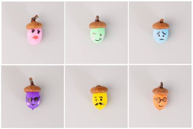 painted different color acorns with various facial expressions arranged in a grid layout on a light grey background. for DIY and craft projects. Autumn and seasonal decoration concept. image of lesson clipart