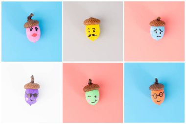 El yapımı meşe palamudu ve çeşitli yüz ifadeleri şebekeye yerleştirilmiş. DIY ve el işi projeleri için. Sonbahar ve mevsimlik dekorasyon konsepti. Düz konum