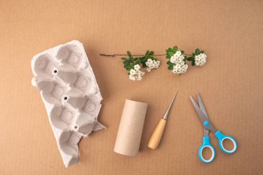 recycled craft ideas for kids, use of toilet paper rolls and other materials for creative projects, flat lay, brown background, top view  clipart