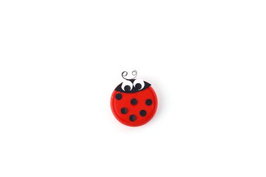 sample ladybug crafted from plastic cap, recycling materials transform in art project for kids, top view, white background, part of DIY process, summer activity for preschooler, useful ideas upcycling clipart