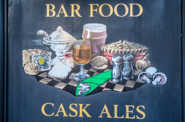 ST. IVES, ENGLAND, UK - DECEMBER 28, 2013: Sign on the exterior of a typical English bar in St. Ives, Cambridgeshire, UK