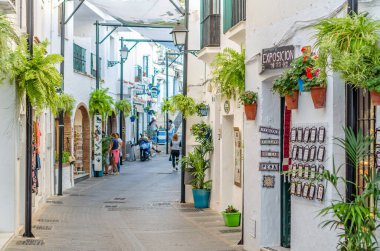 MIJAS, SPAIN - OCTOBER 9, 2021: Souvenir and handicraft shop, with ceramics and other typical products in the village of Mijas on the Costa del Sol, Malaga province, Andalusia, southern Spain