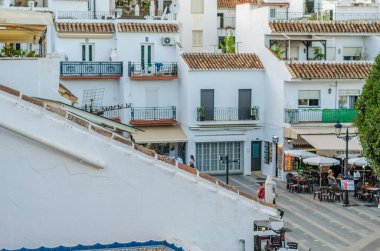 MIJAS, SPAIN - OCTOBER 9, 2021: View of a central square with shops and restaurants in the town of Mijas, located on the Costa del Sol, Malaga province, Andalusia, southern Spain