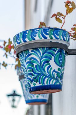 Flower pots decorating typical Andalusian houses in Mijas, Malaga province, southern Spain