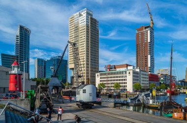 ROTTERDAM, THE NETHERLANDS - AUGUST 26, 2013: Exterior view from the Maritime Museum in the Maritime District of Rotterdam, the Netherlands. The Maritime District was originally a port area, now being transformed into a living area
