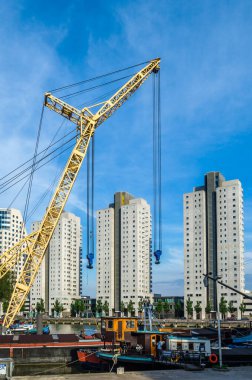 ROTTERDAM, THE NETHERLANDS - AUGUST 26, 2013: Exterior view from the Maritime Museum in the Maritime District of Rotterdam, the Netherlands. The Maritime District was originally a port area, now being transformed into a living area