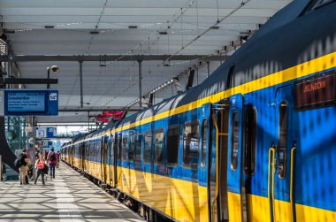 ROTTERDAM, THE NETHERLANDS - AUGUST 23, 2013: Dutch train seen from a platform of the Rotterdam Centraal railway station