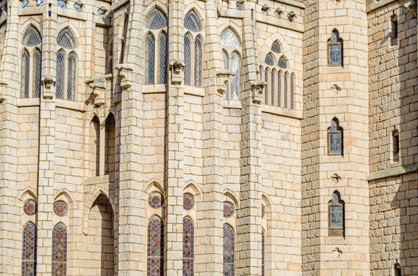 ASTORGA, SPAIN - MARCH 9, 2014: Facade detail of the neo-Gothic Episcopal Palace of Astorga, Castile and Leon, Spain. It was designed by the modernist architect Antoni Gaudi, built between 1889 and 1915