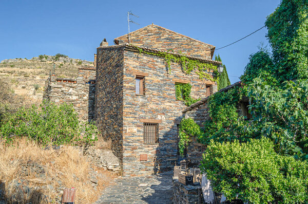 Typical architecture in the town of Patones de Arriba, Spain, one of the most representative examples of so-called black architecture (uses slate as the main construction element, a mineral compound of gray, violet, bluish, brown, silver or blackish 